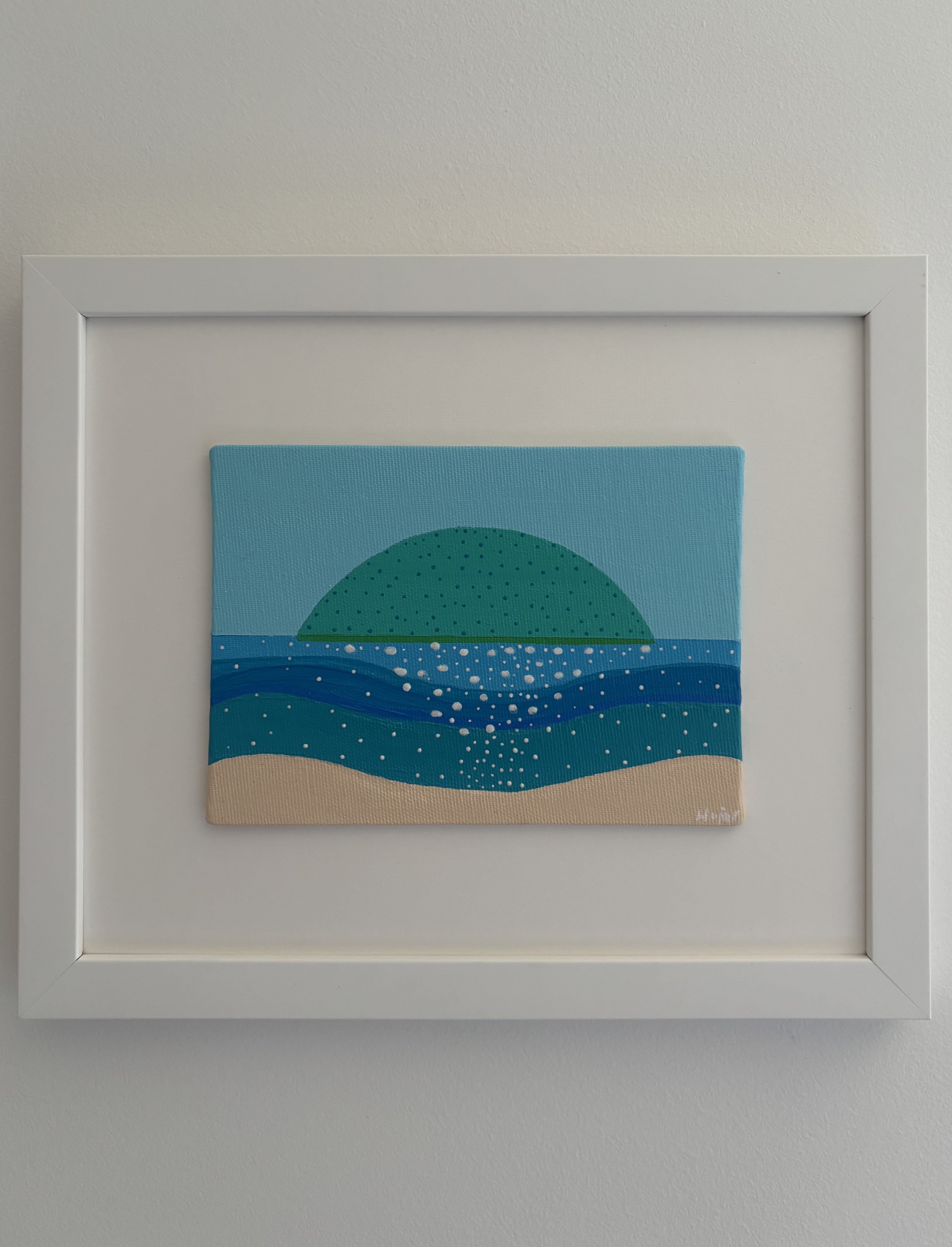The Quiet Island - rounded green island on the horizon with layers of turquoise and blue water